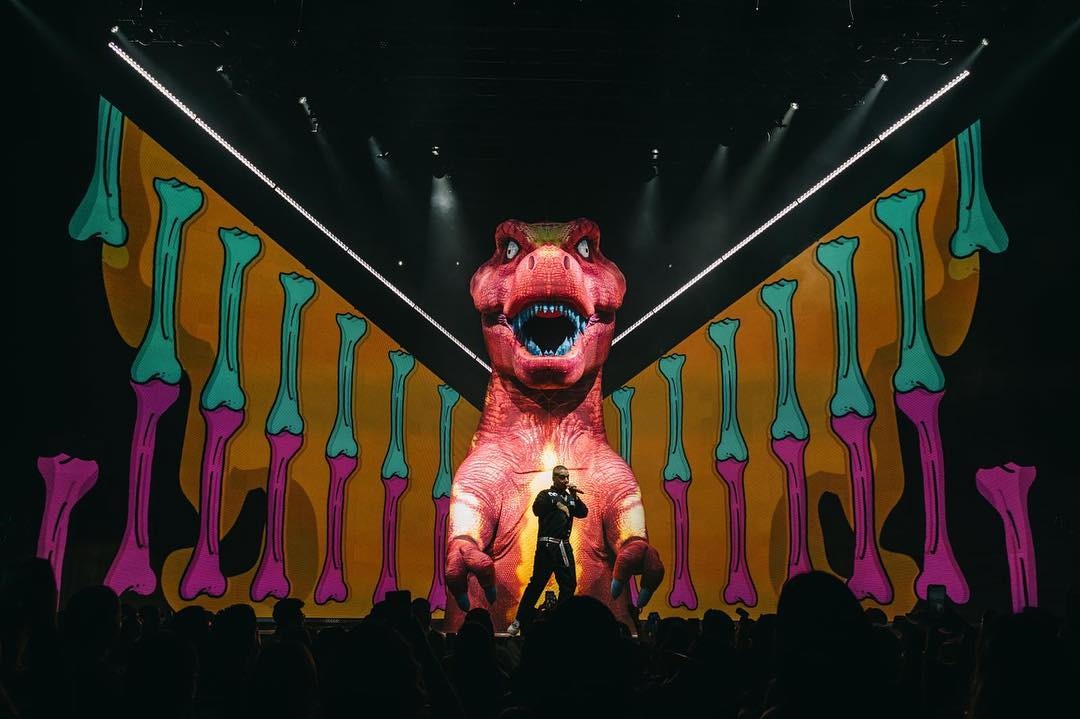 Giant inflatable T-Rex on stage with J Balvin